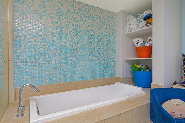a bedroom with furniture and a book shelf
