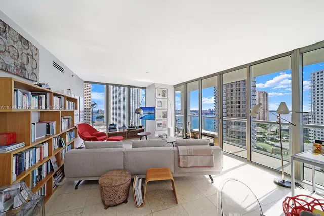 a view of a livingroom with furniture and a flat screen tv