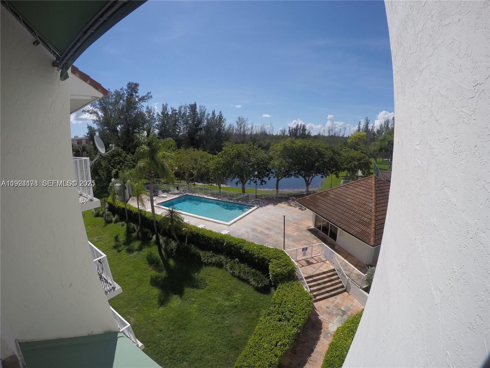 8200 Southwest 210th Street, Unit 320 Cutler Bay, FL 33189 - Photo 2 of 14 a view of a lake from a balcony