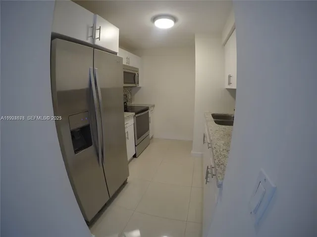 a bathroom with a shower and a mirror