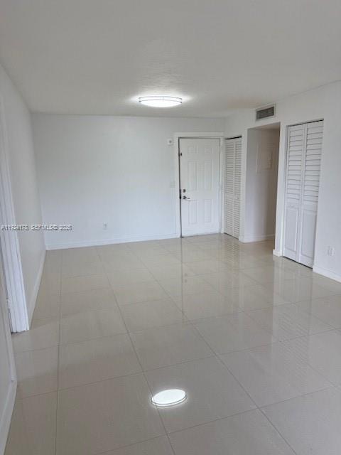 8200 Southwest 210th Street, Unit 320 Cutler Bay, FL 33189 - Photo 4 of 14 a view of an empty room with wooden floor