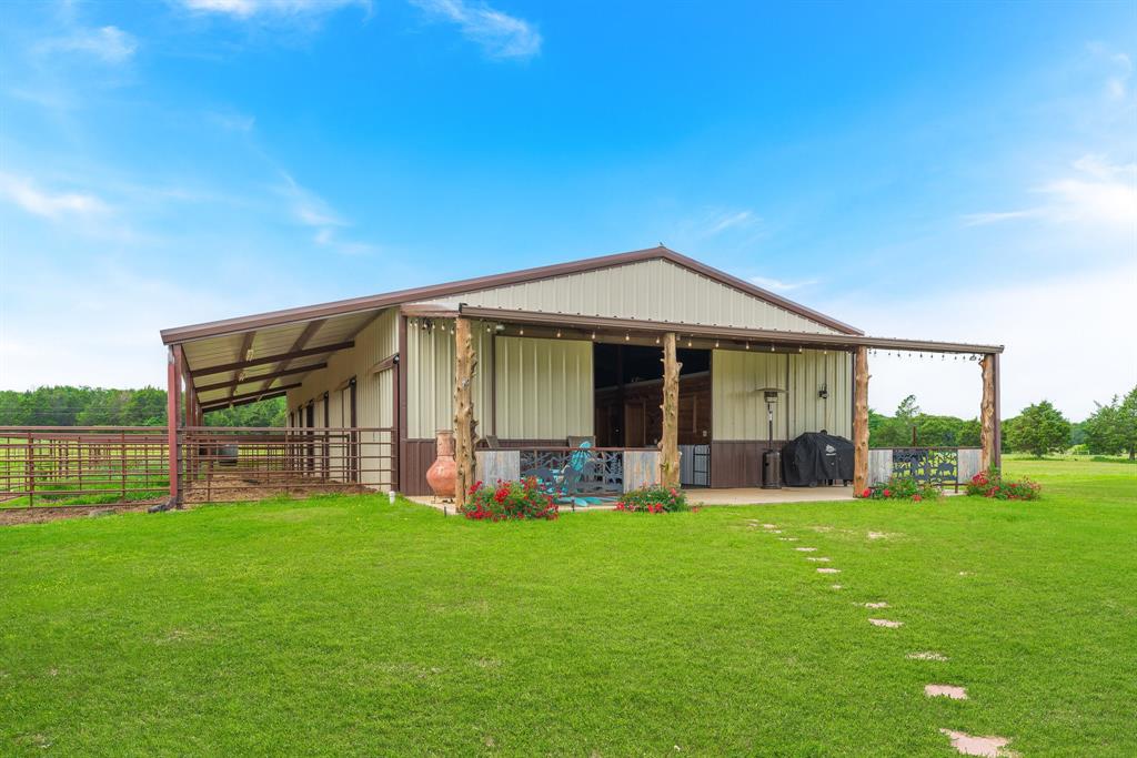 289 Blackjack Road Valley View, TX 76272 - Photo 11 of 40 a view of a house with a yard and sitting area