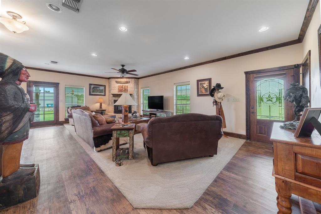 289 Blackjack Road Valley View, TX 76272 - Photo 18 of 40 a living room with furniture and a flat screen tv