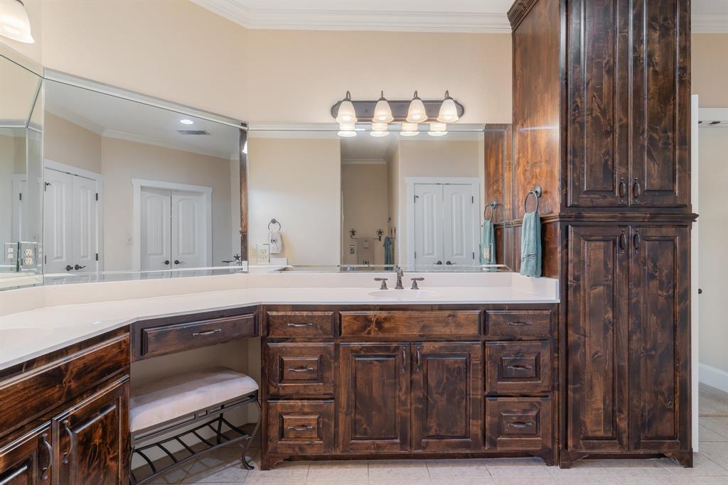 289 Blackjack Road Valley View, TX 76272 - Photo 28 of 40 a spacious bathroom with a sink double vanity granite and a mirror