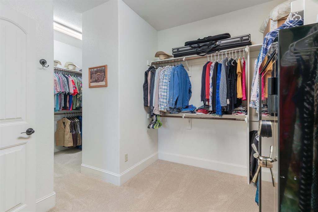 289 Blackjack Road Valley View, TX 76272 - Photo 29 of 40 a view of walk in closet with clothes and shoes