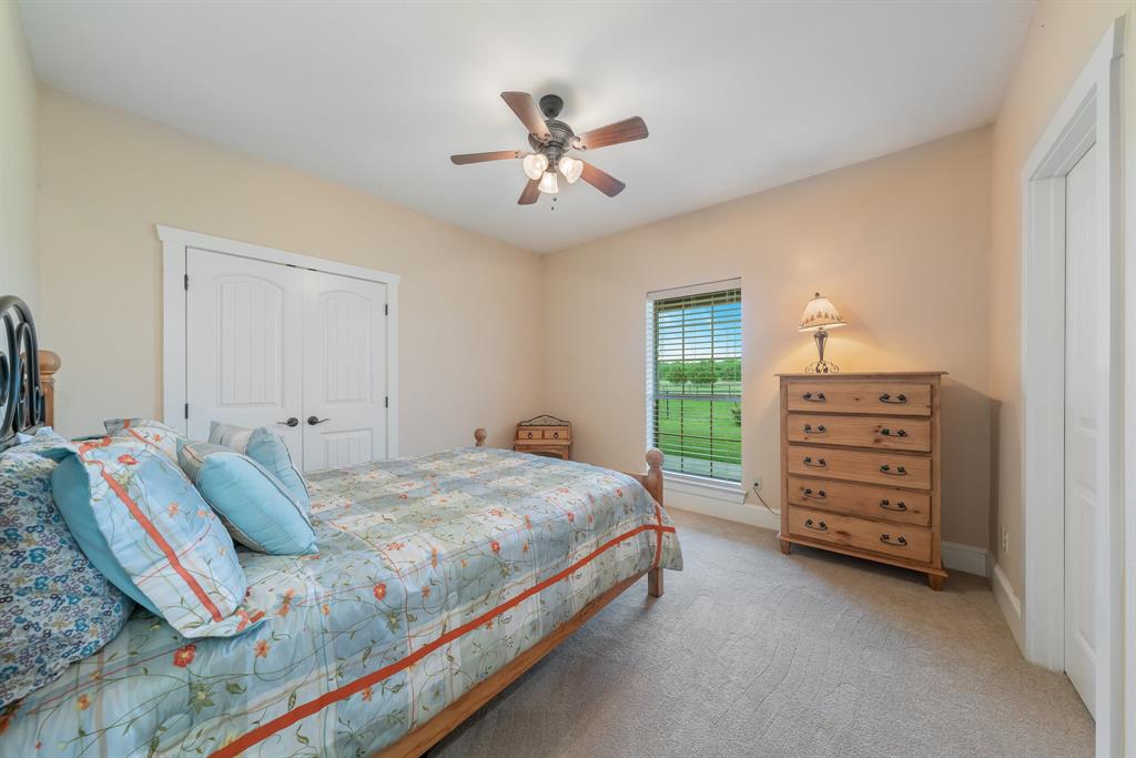 289 Blackjack Road Valley View, TX 76272 - Photo 30 of 40 a bedroom with a bed and a dresser