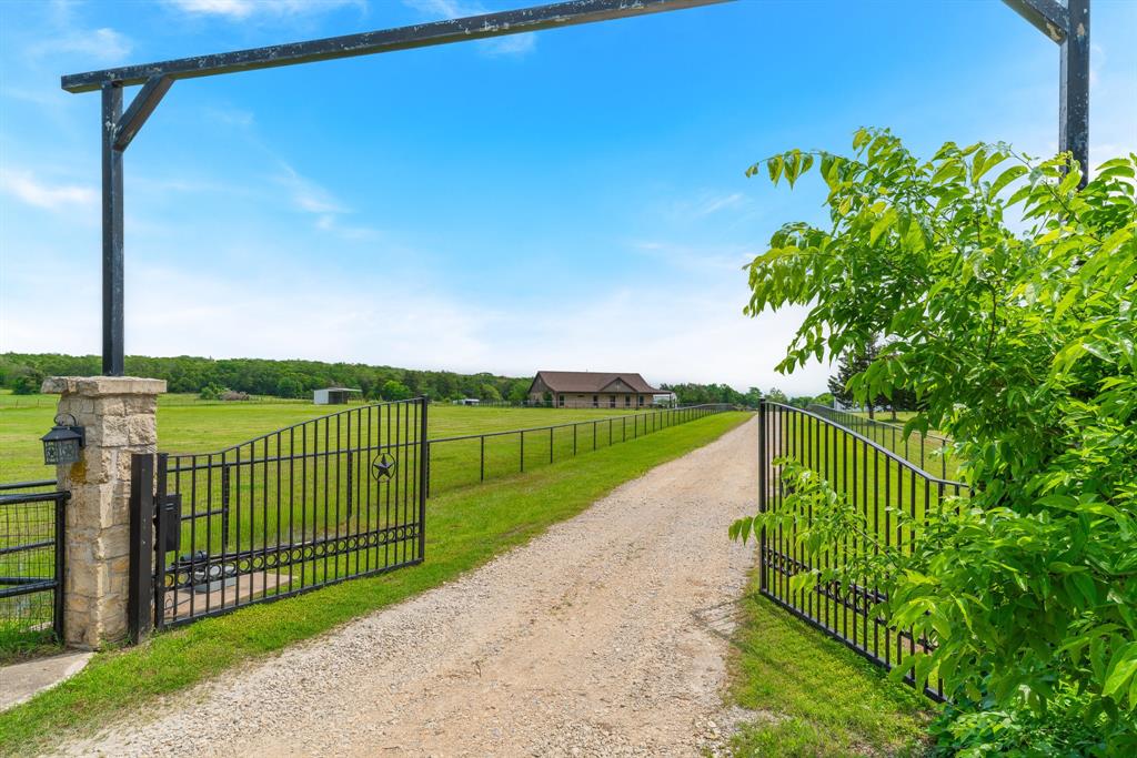 289 Blackjack Road Valley View, TX 76272 - Photo 6 of 40 a view of a pathway with a garden