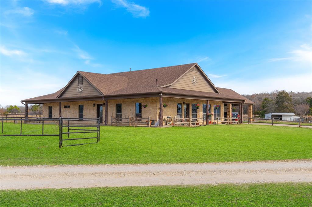 289 Blackjack Road Valley View, TX 76272 - Photo 9 of 40 a front view of a house with a garden and trees