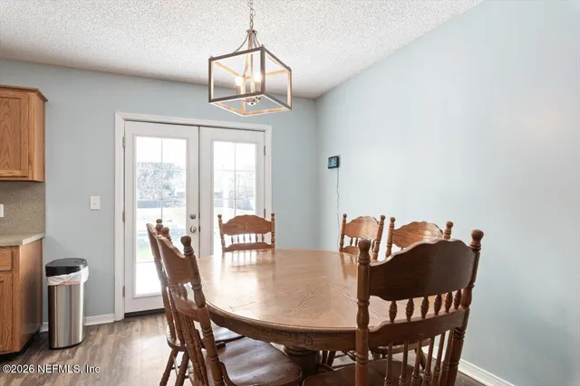 an aerial view of a house with a yard swimming pool and outdoor seating