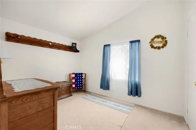 a view of storage and utility room with a window