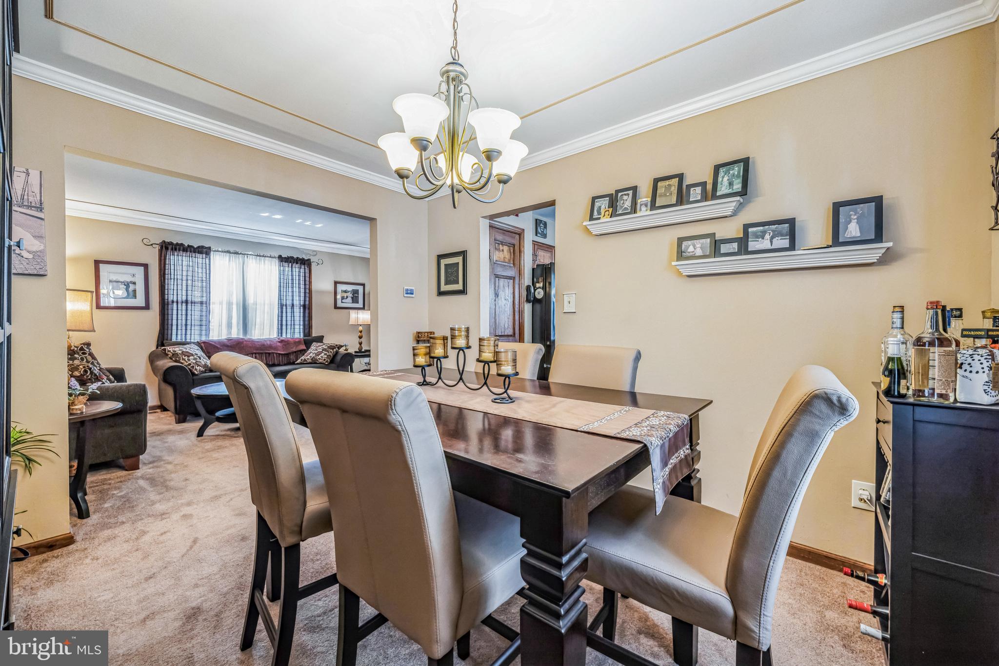 415 Doerrmann Drive Mickleton, NJ 08056 - Photo 11 of 38 a view of a dining room with furniture and a chandelier