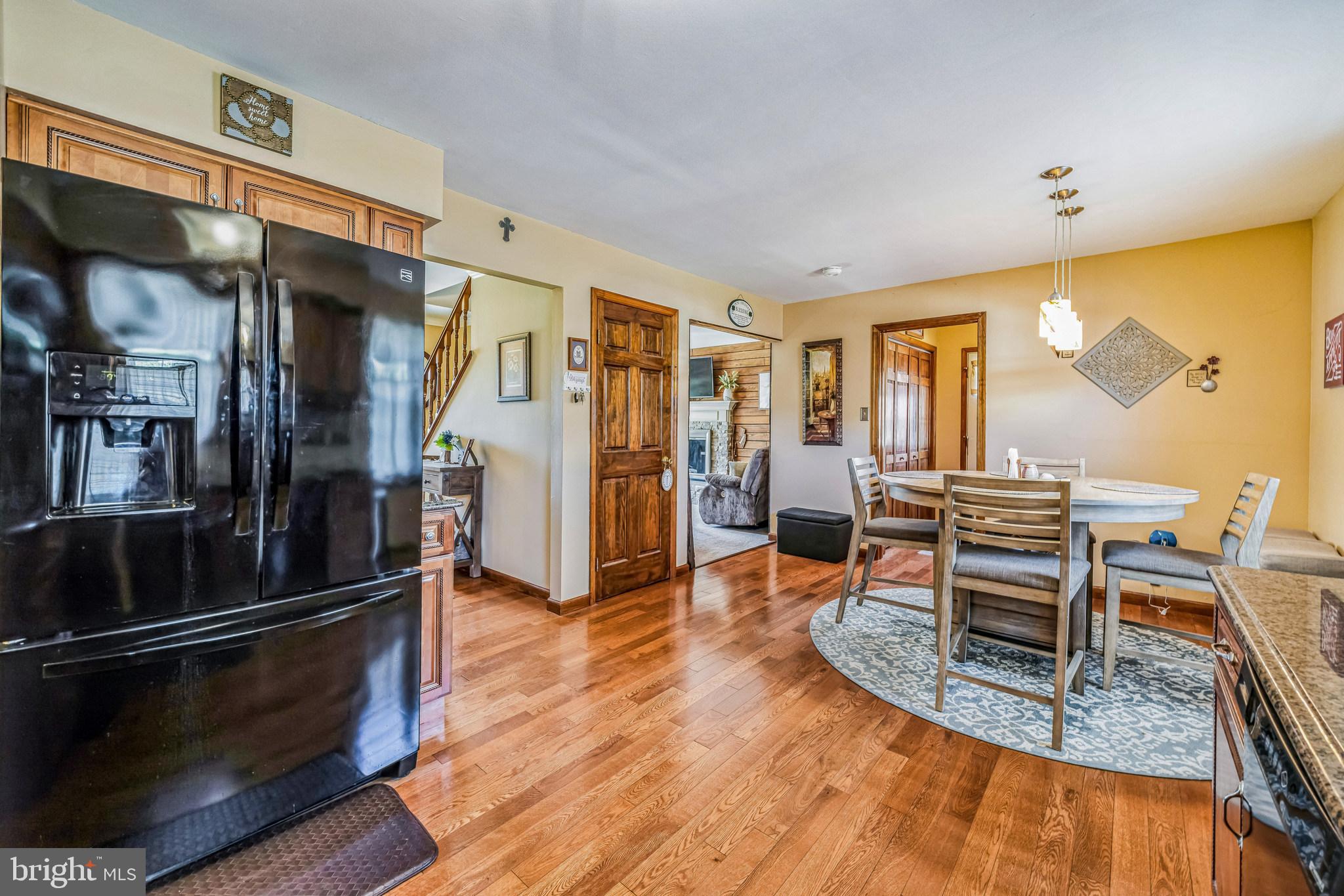 415 Doerrmann Drive Mickleton, NJ 08056 - Photo 16 of 38 a view of a dining room with furniture a kitchen and chandelier