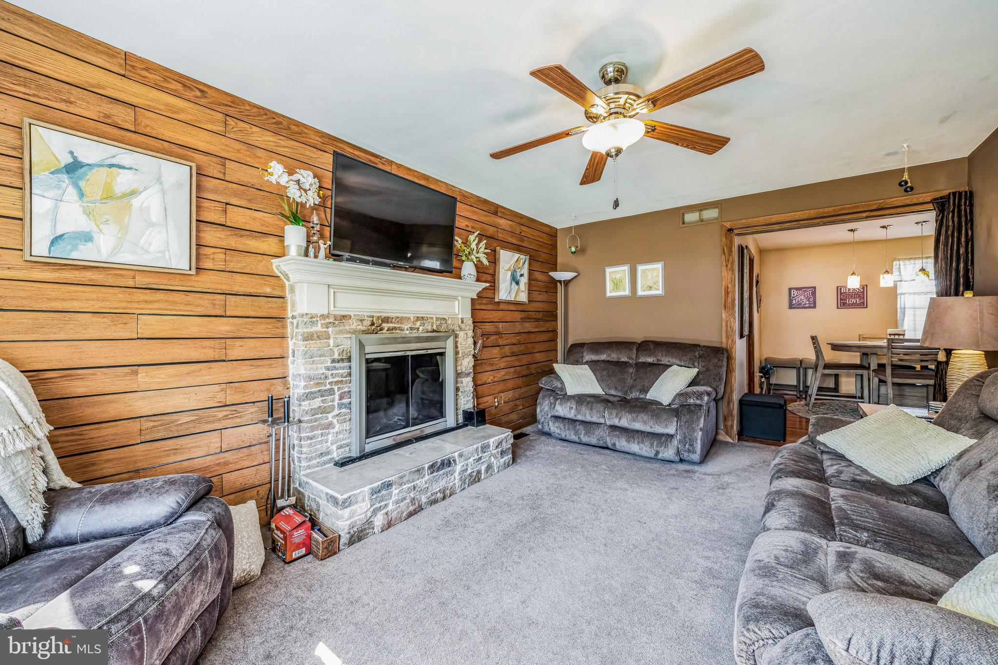 415 Doerrmann Drive Mickleton, NJ 08056 - Photo 19 of 38 a living room with furniture ceiling fan and a fireplace