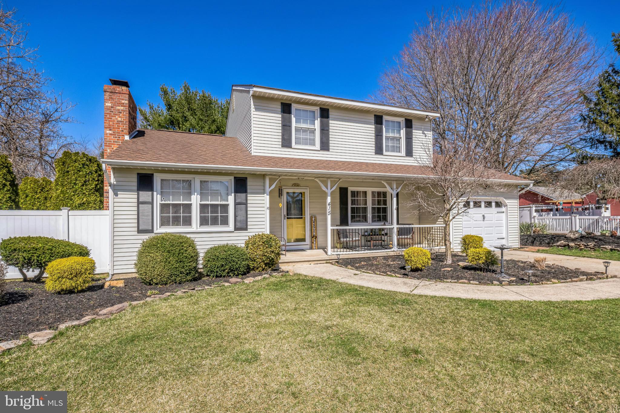 415 Doerrmann Drive Mickleton, NJ 08056 - Photo 2 of 38 a front view of a house with garden and porch