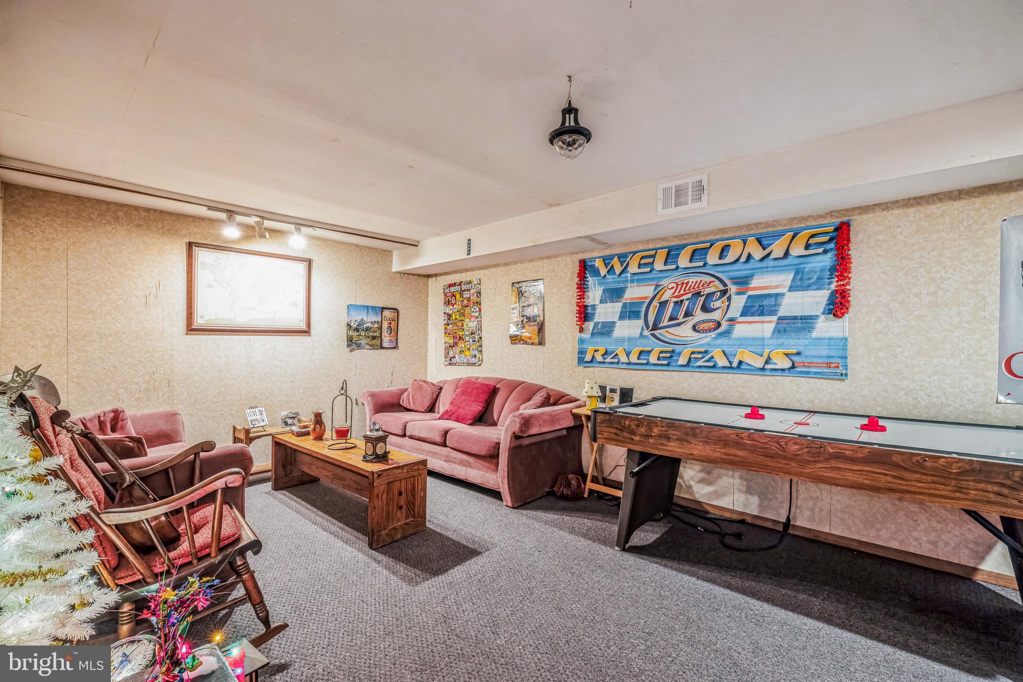 415 Doerrmann Drive Mickleton, NJ 08056 - Photo 26 of 38 a living room with furniture a rug and a wall painting