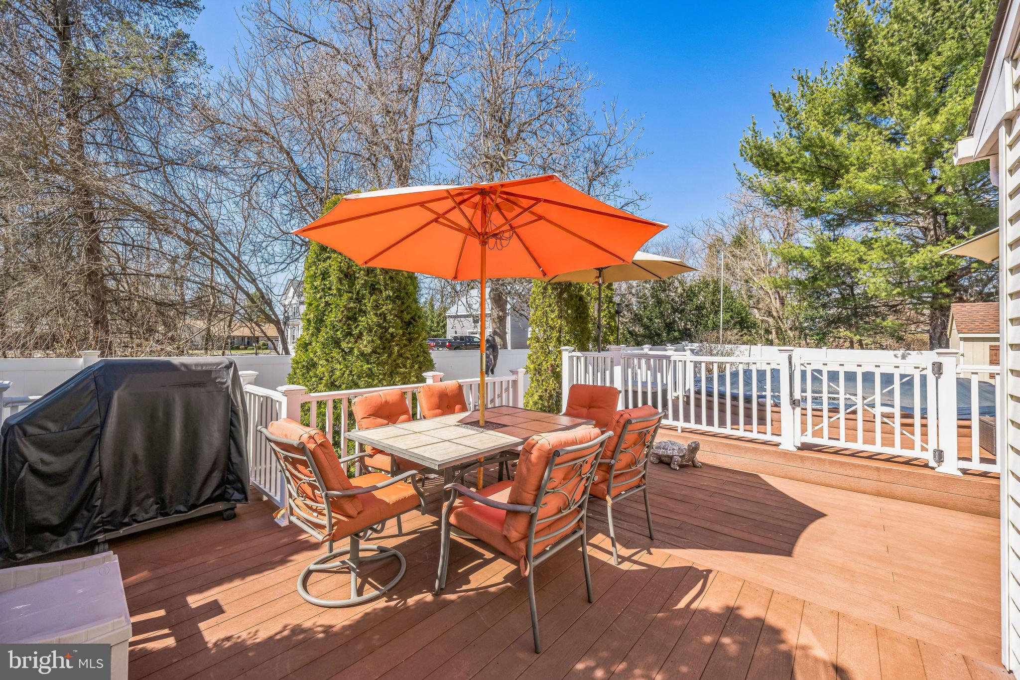 415 Doerrmann Drive Mickleton, NJ 08056 - Photo 30 of 38 a view of a table and chairs on the deck