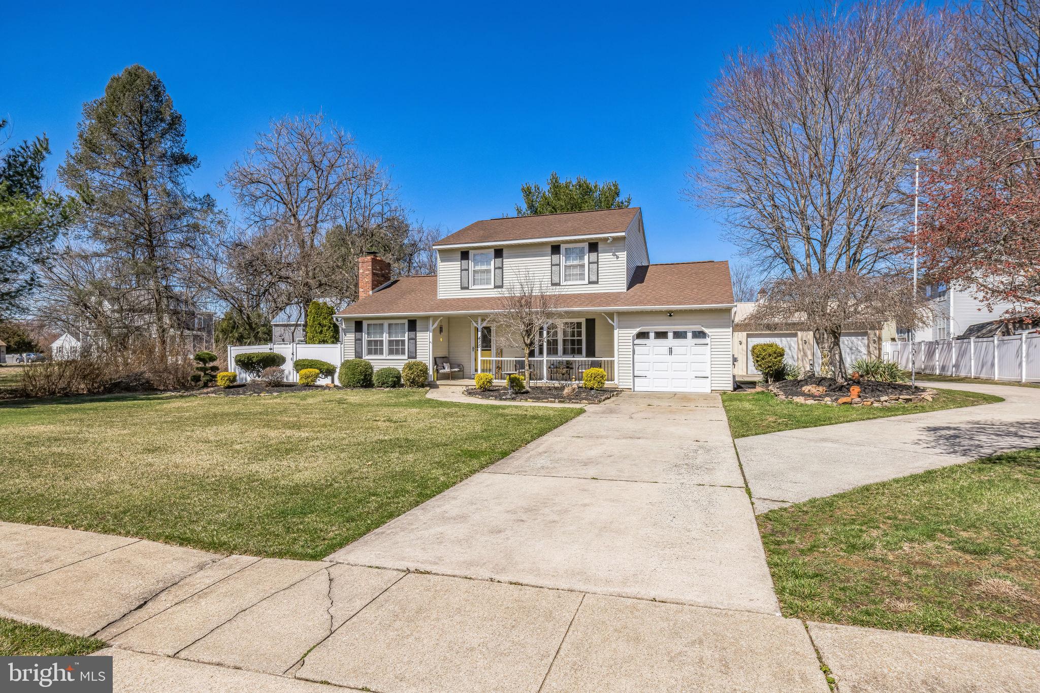 415 Doerrmann Drive Mickleton, NJ 08056 - Photo 4 of 38 a front view of a house with a yard