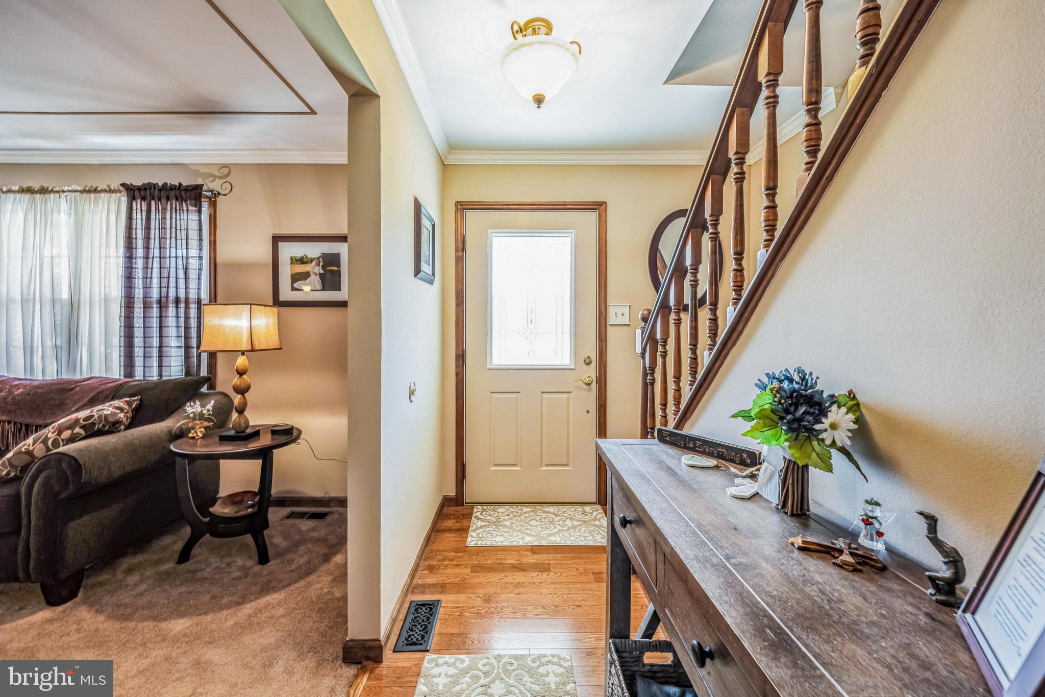 415 Doerrmann Drive Mickleton, NJ 08056 - Photo 6 of 38 a living room with furniture and a potted plant