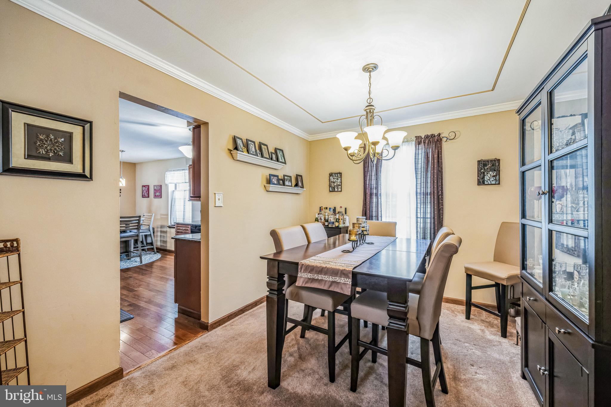 415 Doerrmann Drive Mickleton, NJ 08056 - Photo 10 of 38 a view of a dining room with furniture window and wooden floor