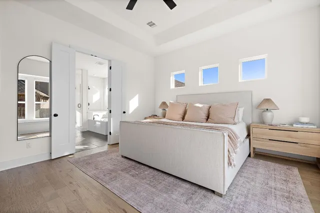 a living room with furniture and view of bathroom