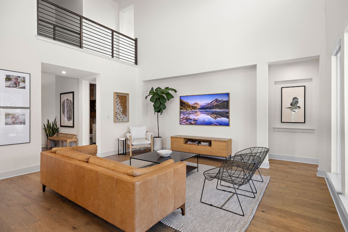 2420 Costera Street Leander, TX 78641 - Photo 6 of 40 Living area with a high ceiling and wood finished floors