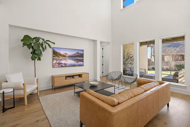 a living room with furniture flowerpot and window