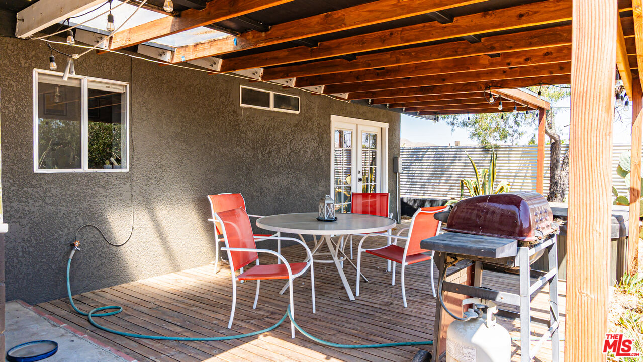 62033 Bonair Road Joshua Tree, CA 92252 - Photo 29 of 53 a patio with table and chairs
