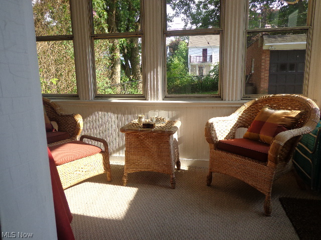 4366 Silsby Road University Heights, OH 44118 - Photo 7 of 23 Enjoy the sun room with Berber carpeting and a door to the back patio.
