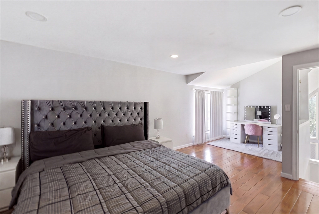 57 Carriage House Path Ashland, MA 01721 - Photo 11 of 37 a bedroom with a bed and wooden floor