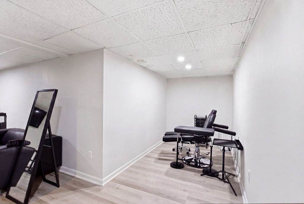 57 Carriage House Path Ashland, MA 01721 - Photo 17 of 37 a view of a workspace with furniture and gym equipment