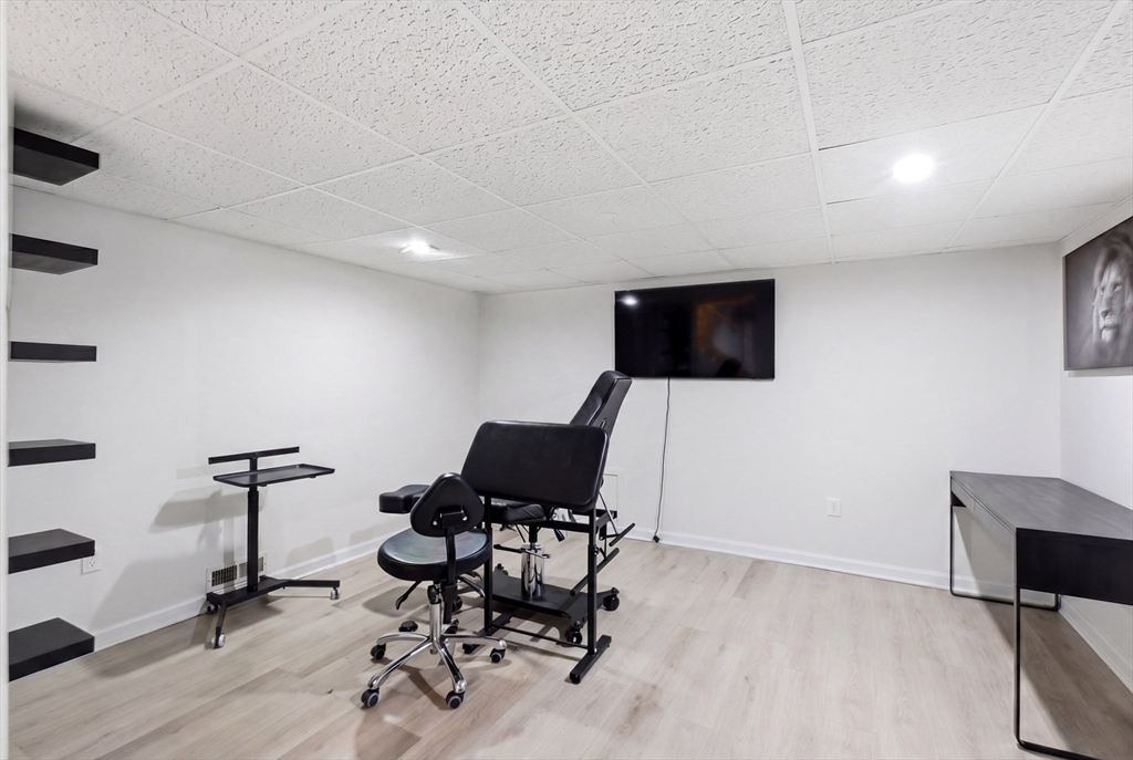 57 Carriage House Path Ashland, MA 01721 - Photo 18 of 37 a view of a livingroom with furniture and a flat screen tv