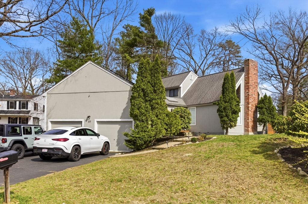 57 Carriage House Path Ashland, MA 01721 - Photo 19 of 37 a couple of cars parked in front of a house