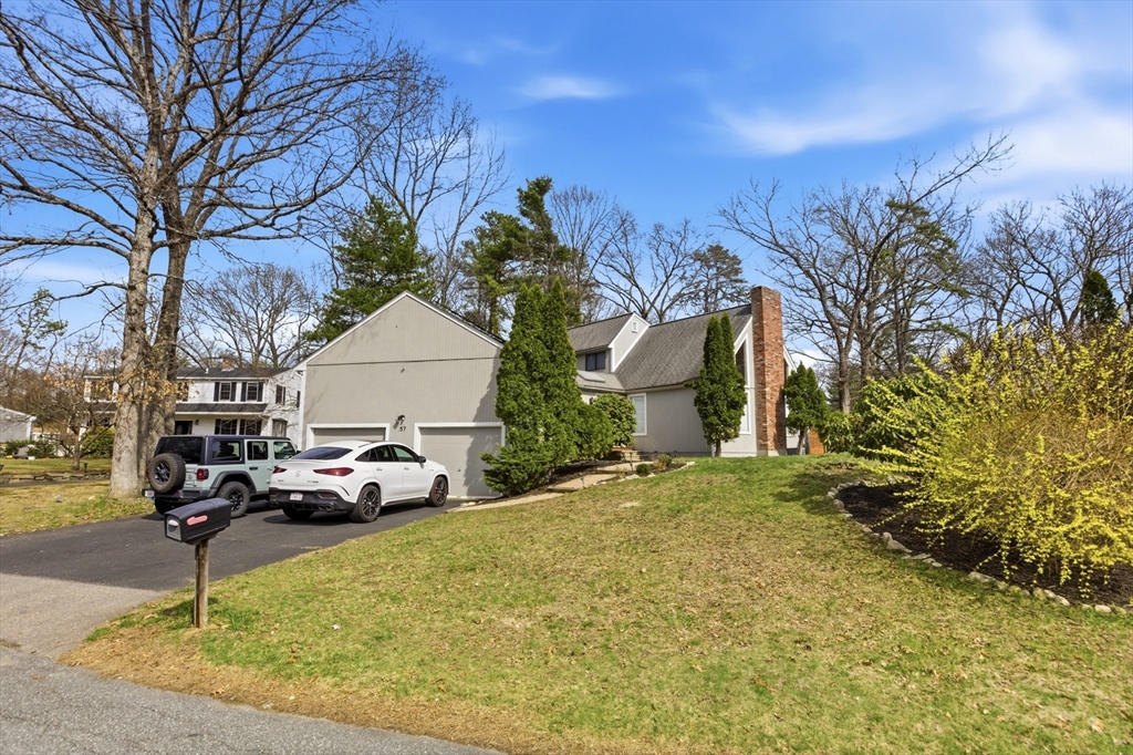 57 Carriage House Path Ashland, MA 01721 - Photo 23 of 37 a front view of a house with a yard