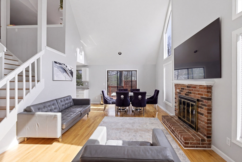 57 Carriage House Path Ashland, MA 01721 - Photo 3 of 37 a living room with fireplace furniture and a rug