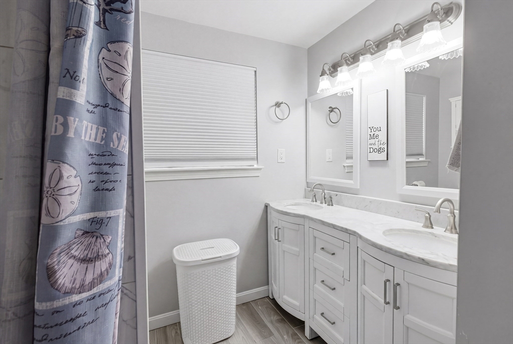 57 Carriage House Path Ashland, MA 01721 - Photo 8 of 37 a spacious bathroom with a granite countertop sink a toilet and a shower