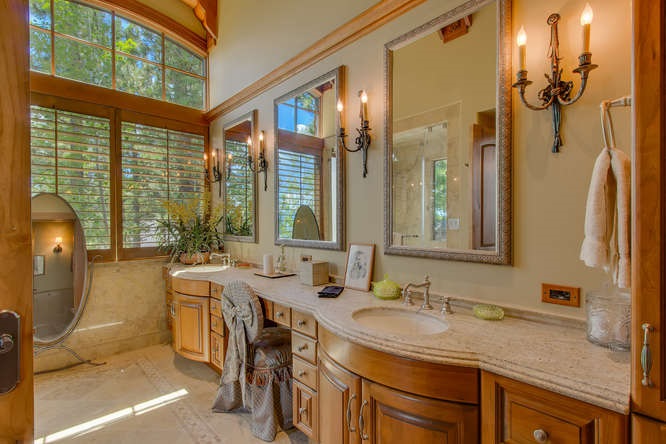8217 Meeks Bay Avenue Meeks Bay, CA 96142 - Photo 14 of 14 a bathroom with a granite countertop sink and a mirror