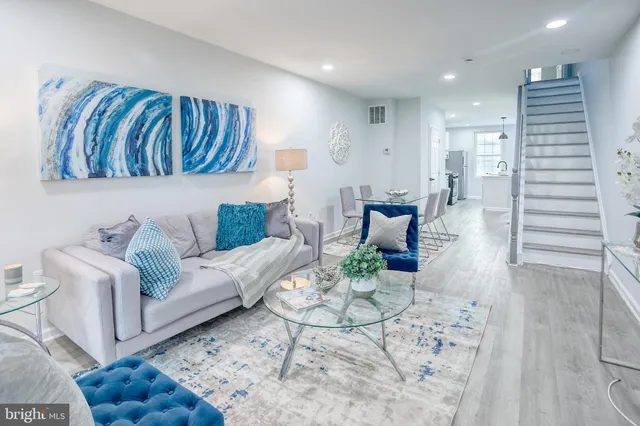 a living room with furniture and a rug