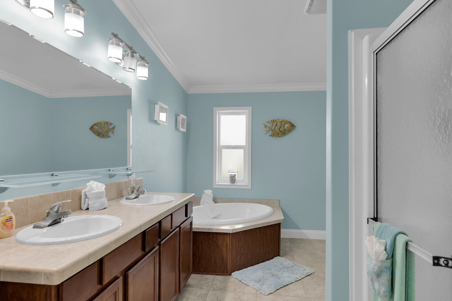 415 Sombrero Beach Road Marathon, FL 33050 - Photo 21 of 41 a bathroom with a sink and a mirror