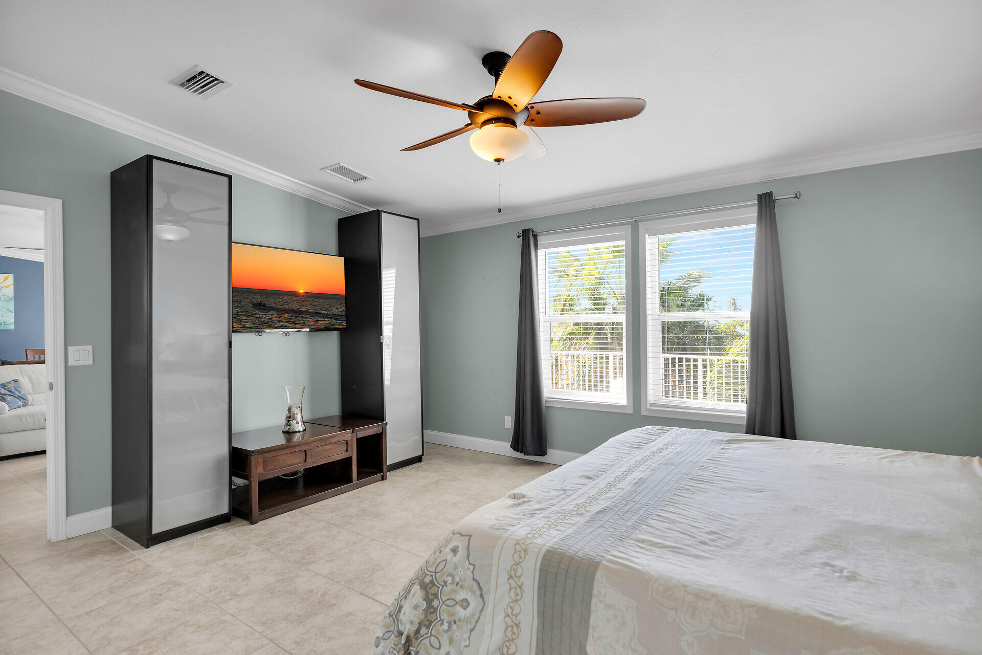 415 Sombrero Beach Road Marathon, FL 33050 - Photo 22 of 41 a bedroom with a bed and a flat screen tv