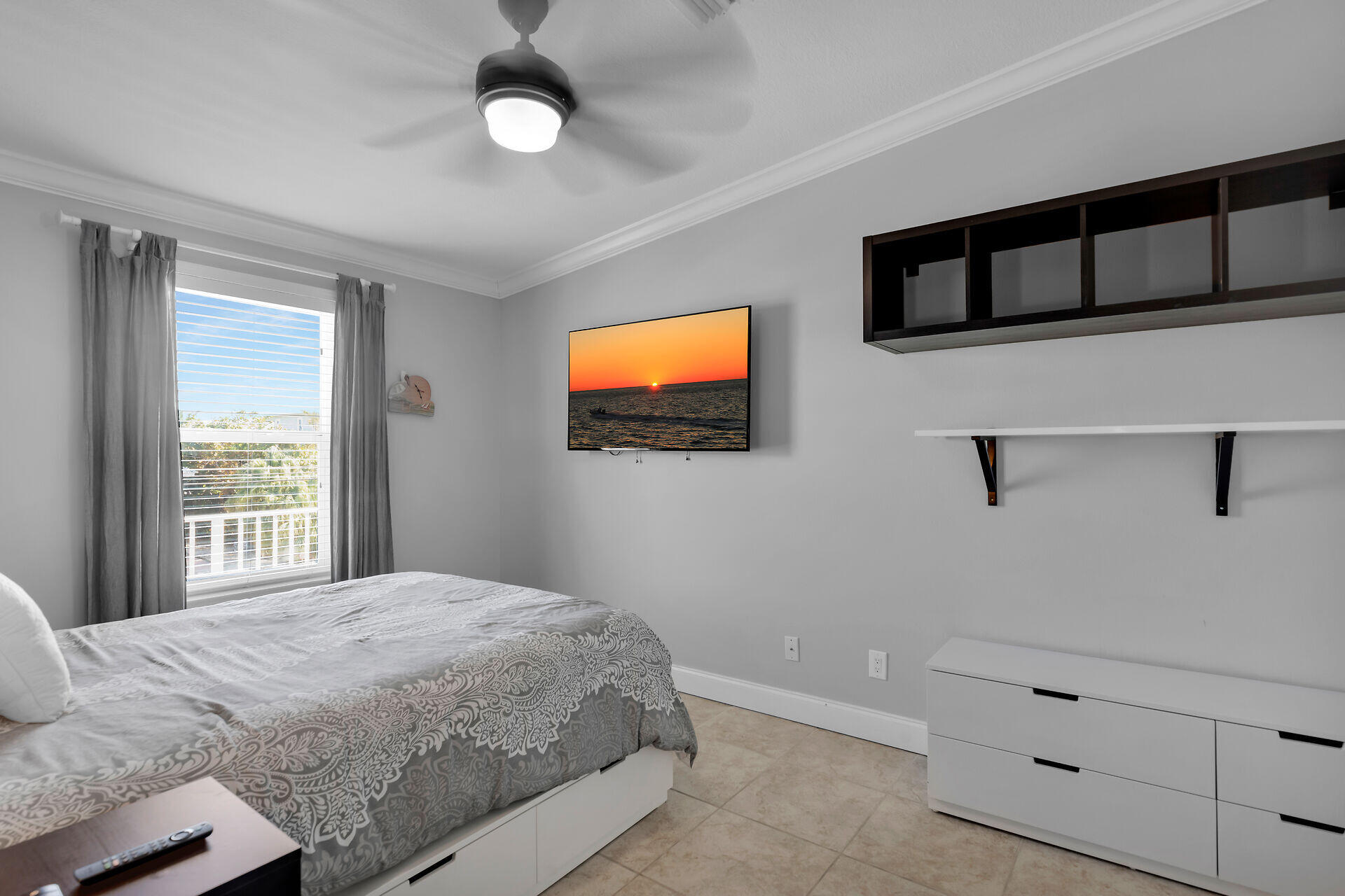 415 Sombrero Beach Road Marathon, FL 33050 - Photo 23 of 41 a bedroom with a bed and a flat screen tv