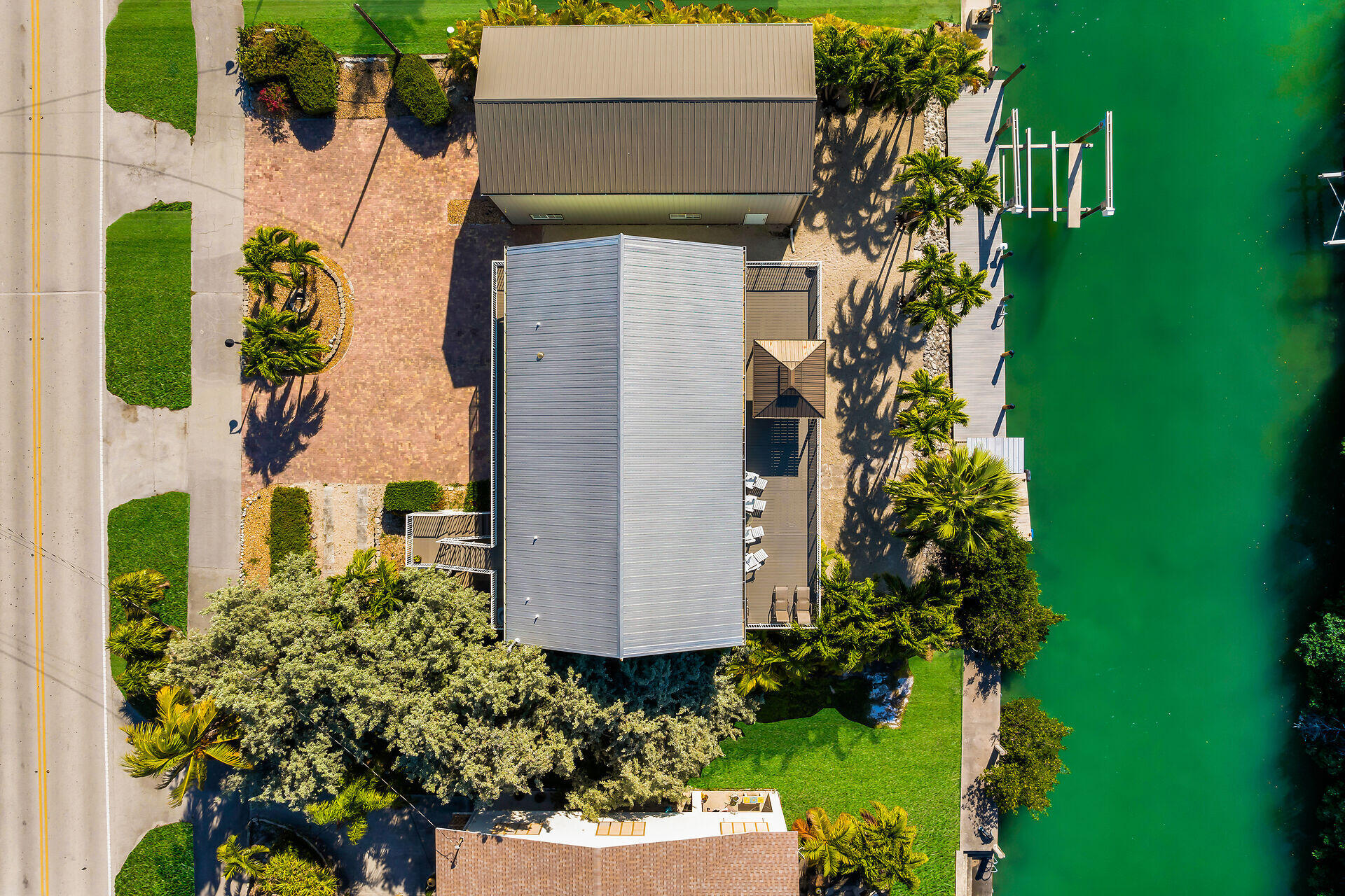 415 Sombrero Beach Road Marathon, FL 33050 - Photo 3 of 41 an aerial view of a house with a yard