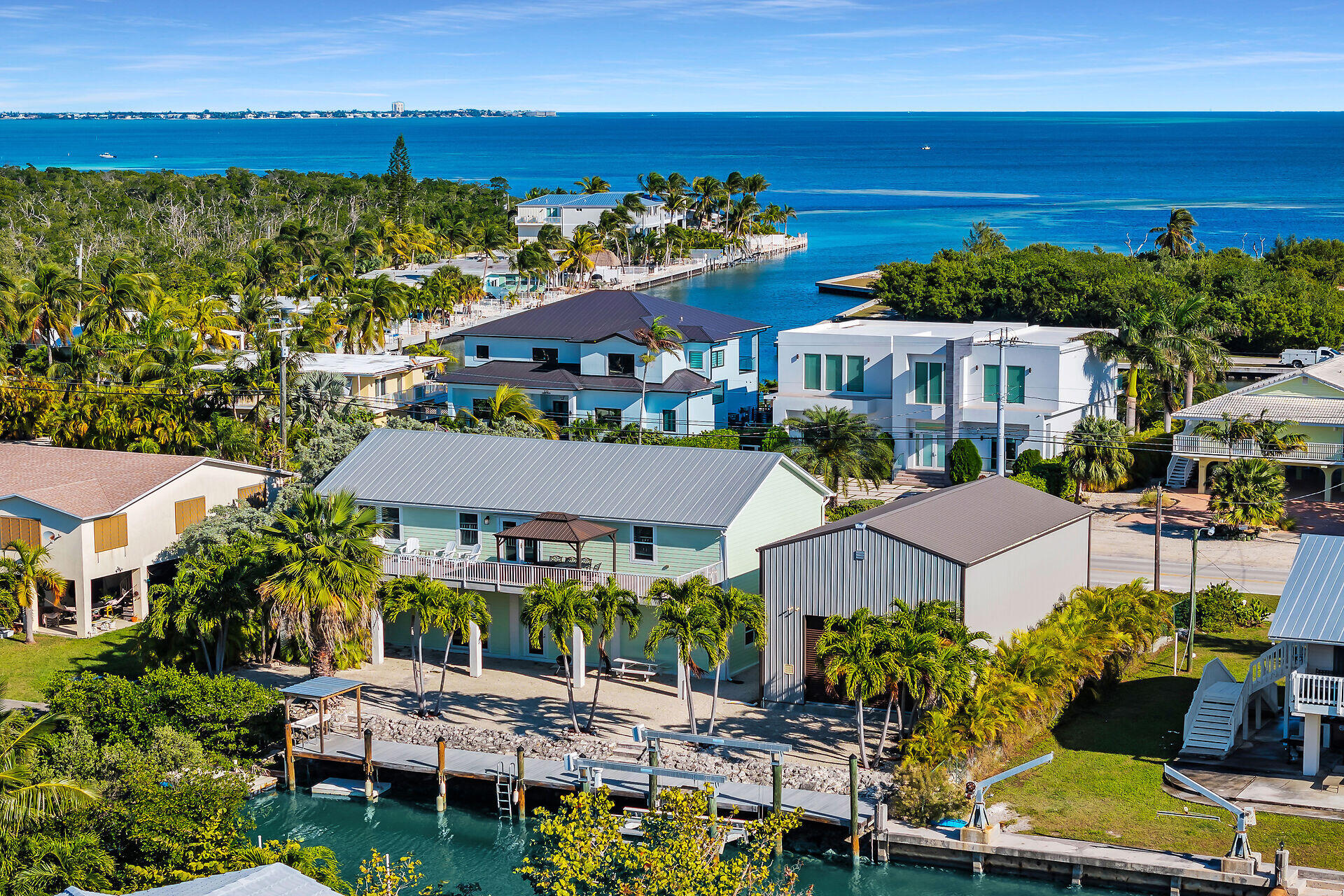 415 Sombrero Beach Road Marathon, FL 33050 - Photo 39 of 41 a view of a chairs and table in a patio with a garden