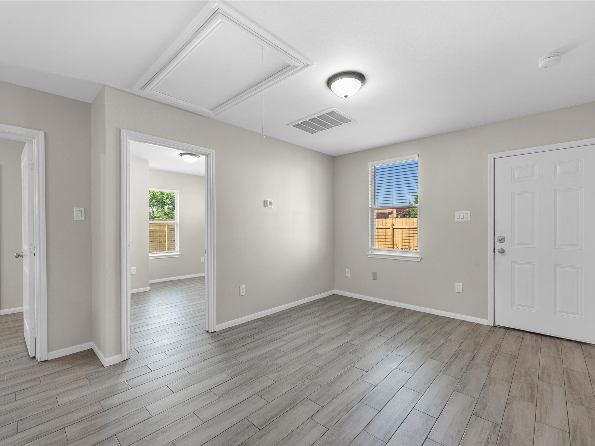 2202 Solo Street, Unit 2204 Houston, TX 77020 - Photo 7 of 21 an empty room with wooden floor and windows
