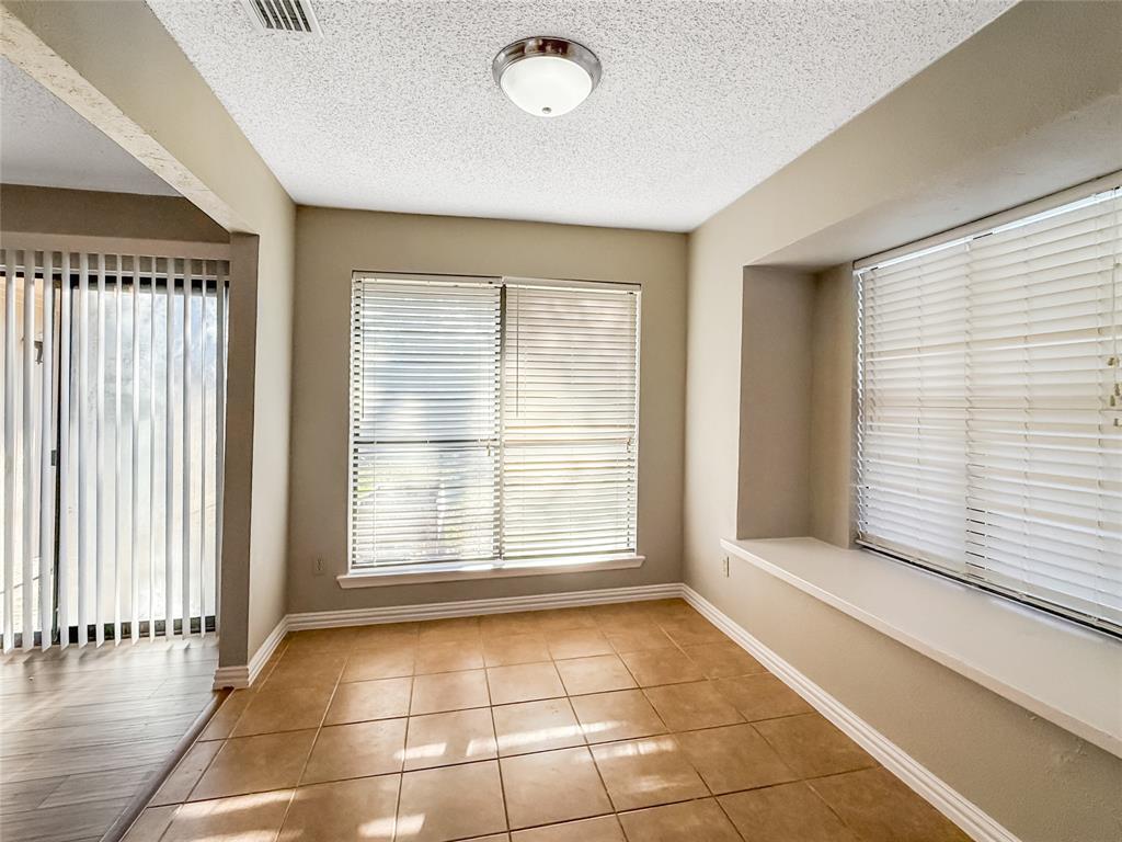 3614 Colbath Drive Garland, TX 75040 - Photo 8 of 24 a view of an empty room with a window