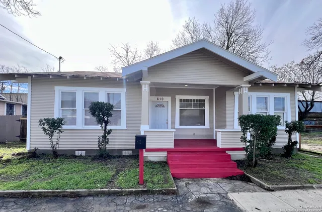 a front view of house with yard and outdoor seating