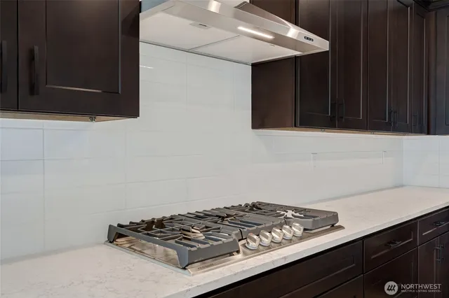 a kitchen with a stove and a microwave