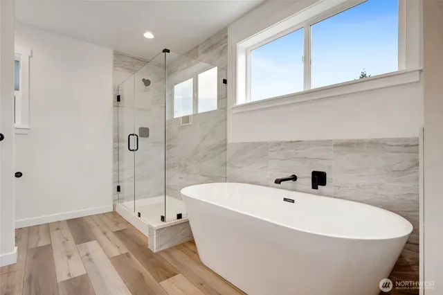 a bathroom with a bathtub and a shower