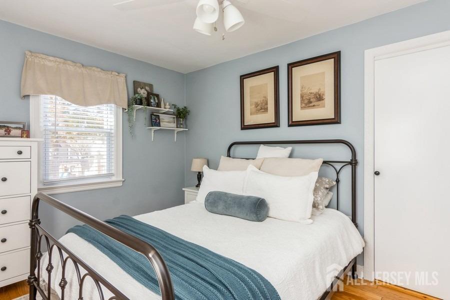 115 Midfield Road Colonia, NJ 07067 - Photo 12 of 25 a bedroom with a bed and a window