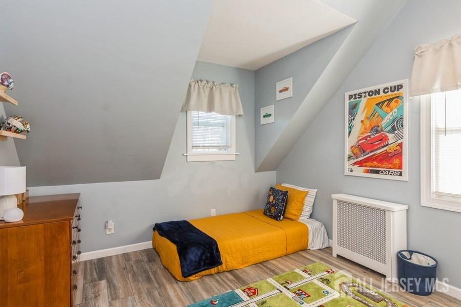 115 Midfield Road Colonia, NJ 07067 - Photo 15 of 25 a bedroom with a bed and a window