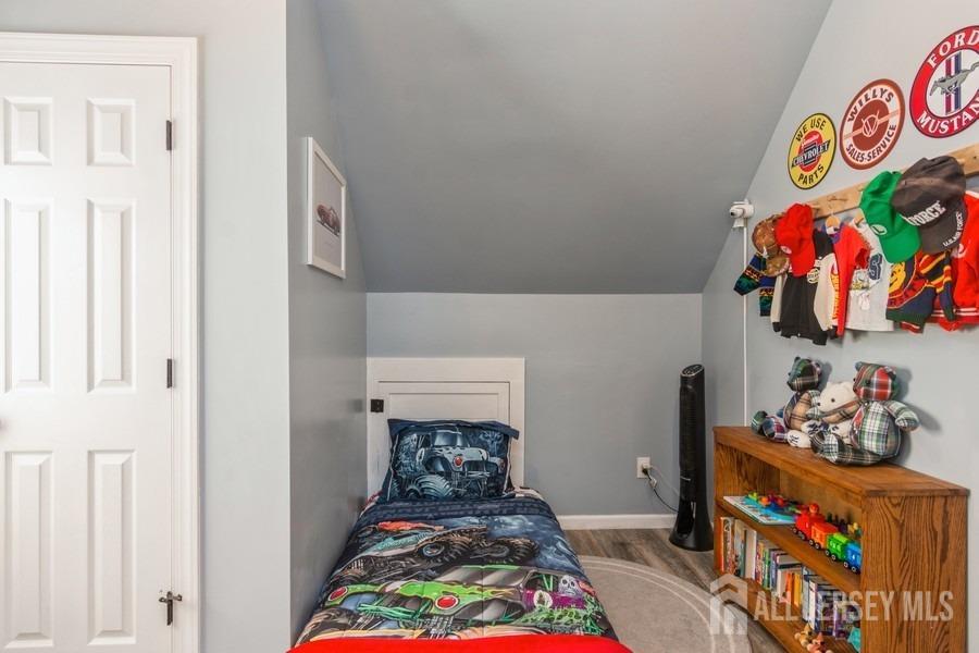 115 Midfield Road Colonia, NJ 07067 - Photo 16 of 25 a room with toys and wooden floor